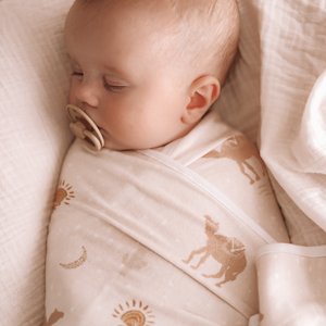 Close up baby boy sleeping - bambini delights neutral swaddle blanket